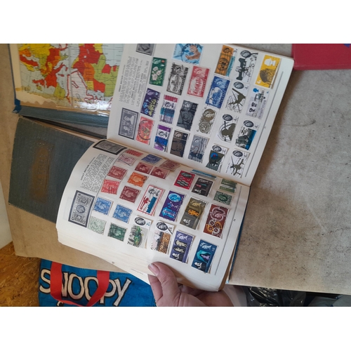 136 - Stamps: a box of stamps albums, ice cream carton of stamps on paper and loose, mixed era world stamp... 