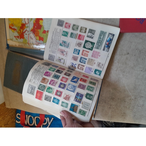 136 - Stamps: a box of stamps albums, ice cream carton of stamps on paper and loose, mixed era world stamp... 