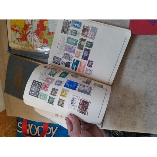 136 - Stamps: a box of stamps albums, ice cream carton of stamps on paper and loose, mixed era world stamp... 