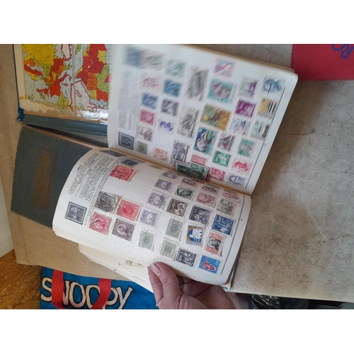 136 - Stamps: a box of stamps albums, ice cream carton of stamps on paper and loose, mixed era world stamp... 