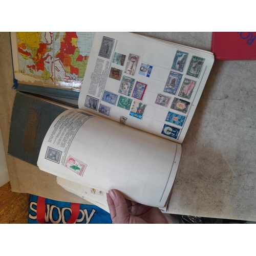 136 - Stamps: a box of stamps albums, ice cream carton of stamps on paper and loose, mixed era world stamp... 