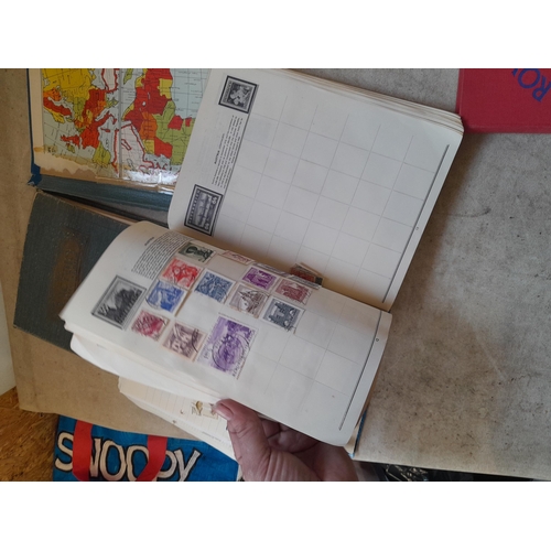 136 - Stamps: a box of stamps albums, ice cream carton of stamps on paper and loose, mixed era world stamp... 