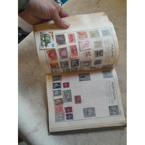 136 - Stamps: a box of stamps albums, ice cream carton of stamps on paper and loose, mixed era world stamp... 