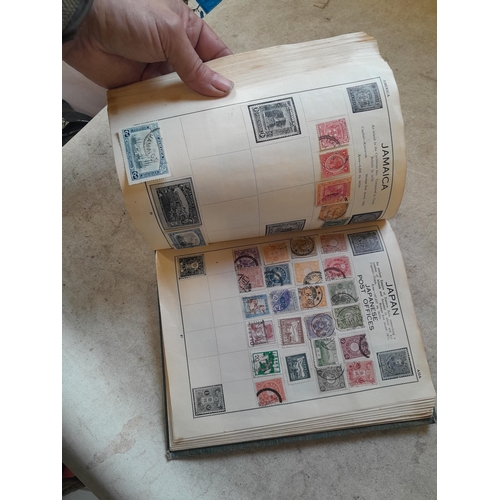 136 - Stamps: a box of stamps albums, ice cream carton of stamps on paper and loose, mixed era world stamp... 