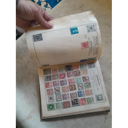 136 - Stamps: a box of stamps albums, ice cream carton of stamps on paper and loose, mixed era world stamp... 