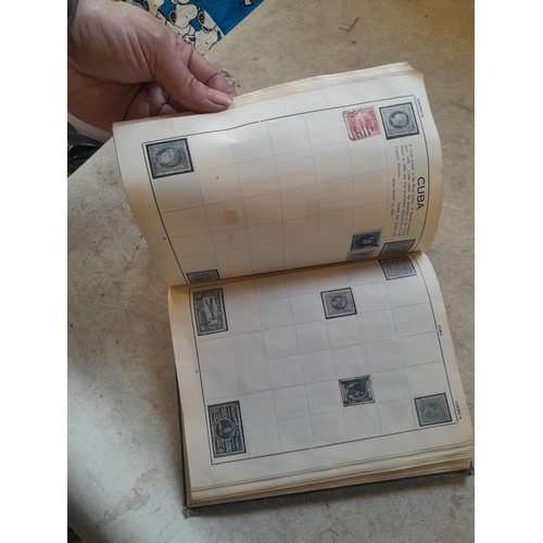 136 - Stamps: a box of stamps albums, ice cream carton of stamps on paper and loose, mixed era world stamp... 