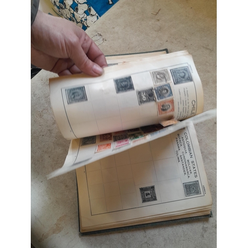 136 - Stamps: a box of stamps albums, ice cream carton of stamps on paper and loose, mixed era world stamp... 