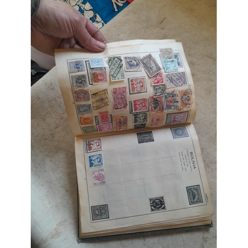 136 - Stamps: a box of stamps albums, ice cream carton of stamps on paper and loose, mixed era world stamp... 