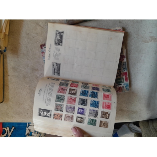 136 - Stamps: a box of stamps albums, ice cream carton of stamps on paper and loose, mixed era world stamp... 