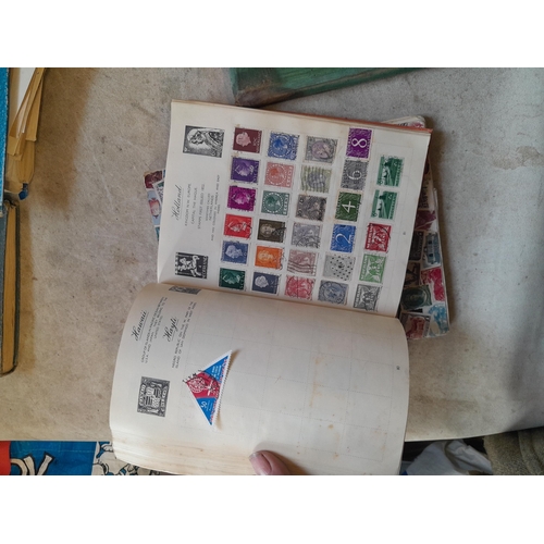 136 - Stamps: a box of stamps albums, ice cream carton of stamps on paper and loose, mixed era world stamp... 