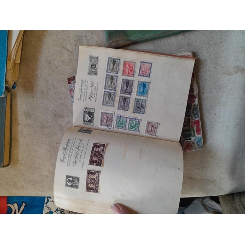136 - Stamps: a box of stamps albums, ice cream carton of stamps on paper and loose, mixed era world stamp... 
