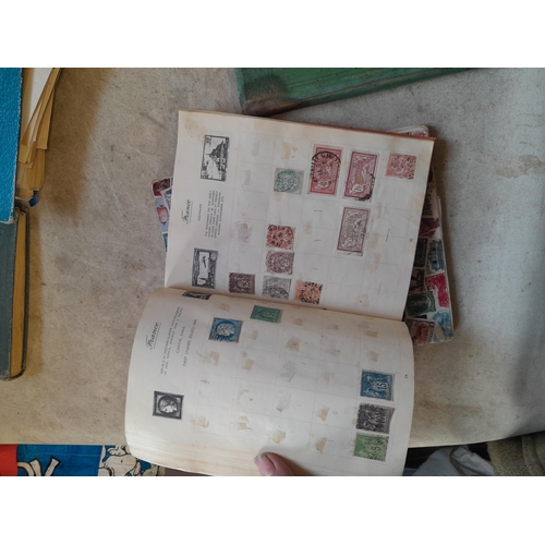 136 - Stamps: a box of stamps albums, ice cream carton of stamps on paper and loose, mixed era world stamp... 