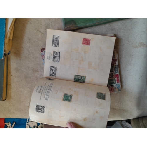 136 - Stamps: a box of stamps albums, ice cream carton of stamps on paper and loose, mixed era world stamp... 