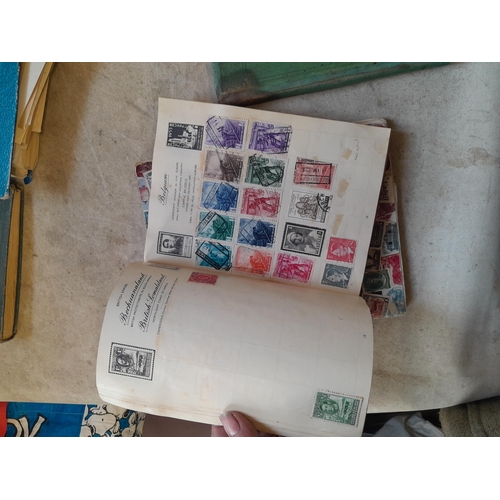 136 - Stamps: a box of stamps albums, ice cream carton of stamps on paper and loose, mixed era world stamp... 