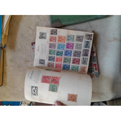 136 - Stamps: a box of stamps albums, ice cream carton of stamps on paper and loose, mixed era world stamp... 