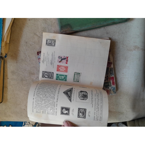 136 - Stamps: a box of stamps albums, ice cream carton of stamps on paper and loose, mixed era world stamp... 