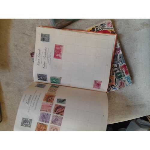 136 - Stamps: a box of stamps albums, ice cream carton of stamps on paper and loose, mixed era world stamp... 