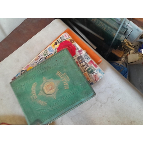 136 - Stamps: a box of stamps albums, ice cream carton of stamps on paper and loose, mixed era world stamp... 