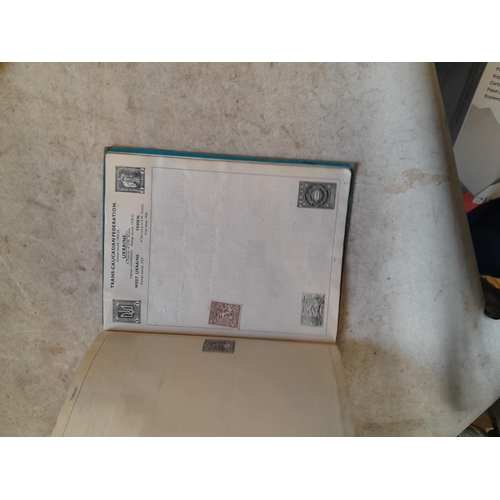 136 - Stamps: a box of stamps albums, ice cream carton of stamps on paper and loose, mixed era world stamp... 