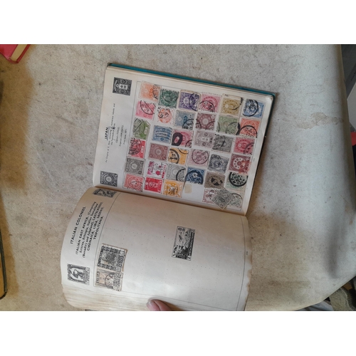 136 - Stamps: a box of stamps albums, ice cream carton of stamps on paper and loose, mixed era world stamp... 