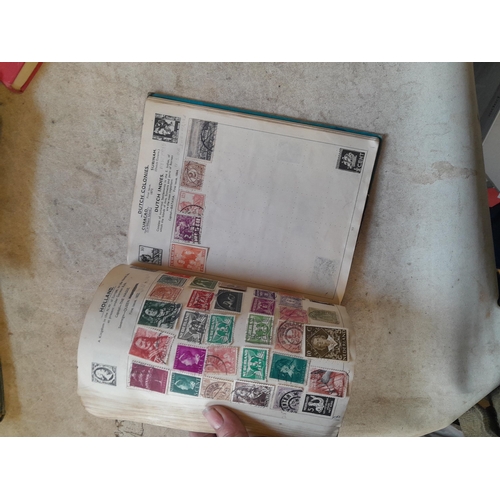 136 - Stamps: a box of stamps albums, ice cream carton of stamps on paper and loose, mixed era world stamp... 