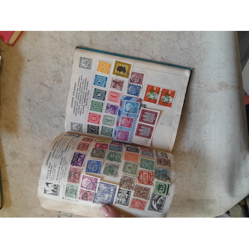 136 - Stamps: a box of stamps albums, ice cream carton of stamps on paper and loose, mixed era world stamp... 