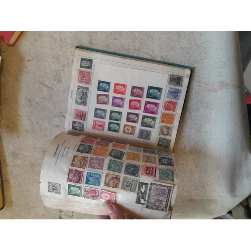 136 - Stamps: a box of stamps albums, ice cream carton of stamps on paper and loose, mixed era world stamp... 