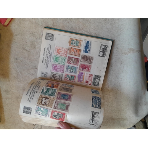 136 - Stamps: a box of stamps albums, ice cream carton of stamps on paper and loose, mixed era world stamp... 