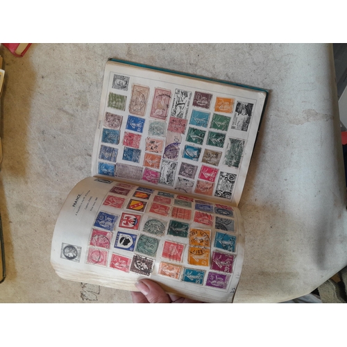 136 - Stamps: a box of stamps albums, ice cream carton of stamps on paper and loose, mixed era world stamp... 