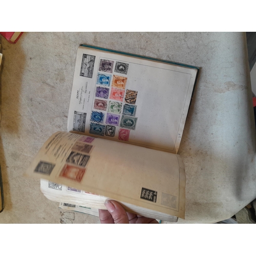 136 - Stamps: a box of stamps albums, ice cream carton of stamps on paper and loose, mixed era world stamp... 