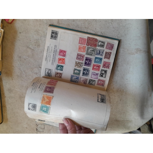 136 - Stamps: a box of stamps albums, ice cream carton of stamps on paper and loose, mixed era world stamp... 