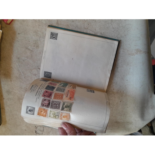 136 - Stamps: a box of stamps albums, ice cream carton of stamps on paper and loose, mixed era world stamp... 