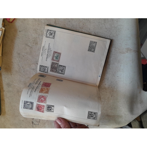 136 - Stamps: a box of stamps albums, ice cream carton of stamps on paper and loose, mixed era world stamp... 