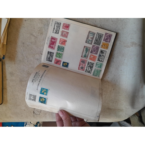 136 - Stamps: a box of stamps albums, ice cream carton of stamps on paper and loose, mixed era world stamp... 