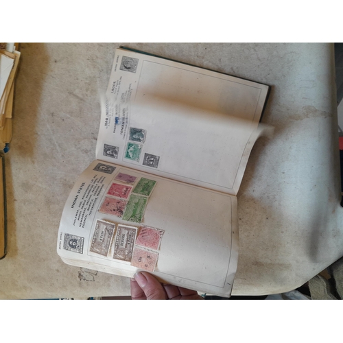 136 - Stamps: a box of stamps albums, ice cream carton of stamps on paper and loose, mixed era world stamp... 