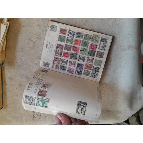 136 - Stamps: a box of stamps albums, ice cream carton of stamps on paper and loose, mixed era world stamp... 