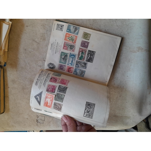 136 - Stamps: a box of stamps albums, ice cream carton of stamps on paper and loose, mixed era world stamp... 