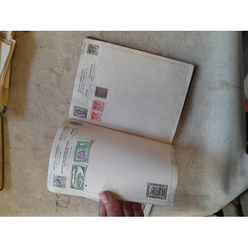 136 - Stamps: a box of stamps albums, ice cream carton of stamps on paper and loose, mixed era world stamp... 