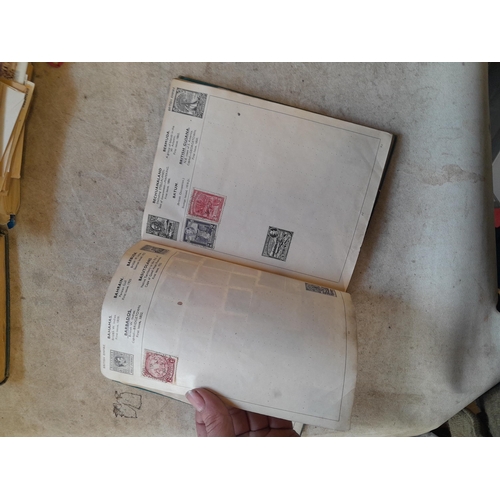 136 - Stamps: a box of stamps albums, ice cream carton of stamps on paper and loose, mixed era world stamp... 