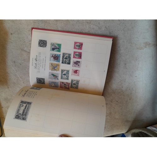 136 - Stamps: a box of stamps albums, ice cream carton of stamps on paper and loose, mixed era world stamp... 