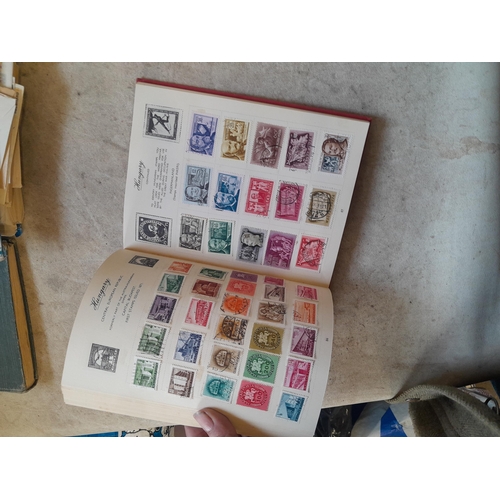 136 - Stamps: a box of stamps albums, ice cream carton of stamps on paper and loose, mixed era world stamp... 