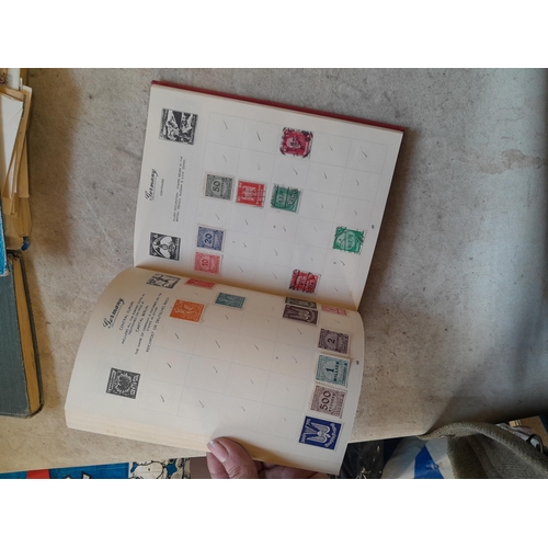 136 - Stamps: a box of stamps albums, ice cream carton of stamps on paper and loose, mixed era world stamp... 