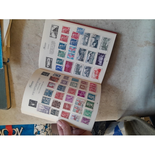 136 - Stamps: a box of stamps albums, ice cream carton of stamps on paper and loose, mixed era world stamp... 