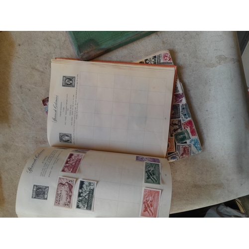 136 - Stamps: a box of stamps albums, ice cream carton of stamps on paper and loose, mixed era world stamp... 