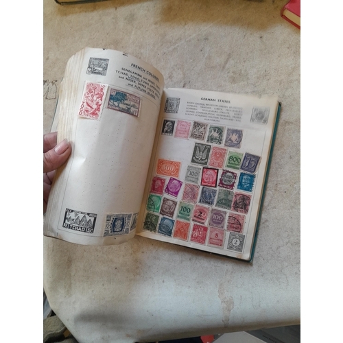 136 - Stamps: a box of stamps albums, ice cream carton of stamps on paper and loose, mixed era world stamp... 