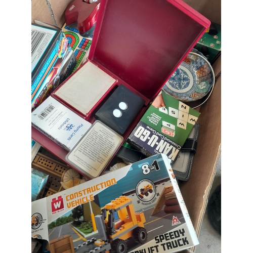 148 - Box of assorted puzzles, reproduction folding cribbage boards, resin figures etc.