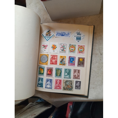 166 - Approx 10 kg of stamps and postcards : loose on paper, in albums, stock books, on pages GB World and... 