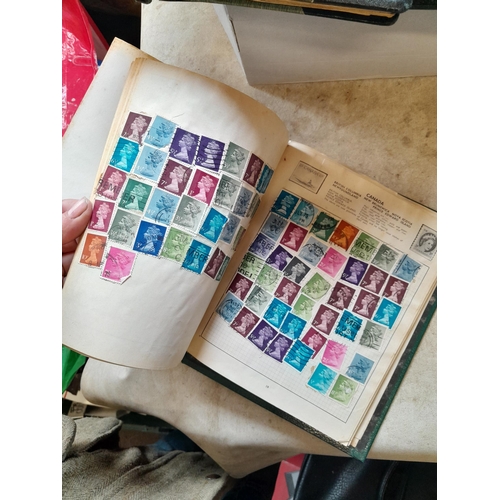 166 - Approx 10 kg of stamps and postcards : loose on paper, in albums, stock books, on pages GB World and... 