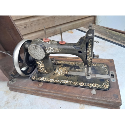 170 - Early 20th century hand crank sewing machine in wooden box