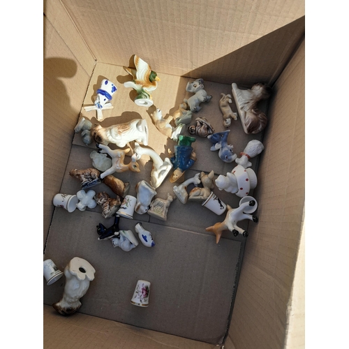 295 - Box of decorative china : Doulton, Wedgwood Beatrix Potter related ceramics, small ornaments